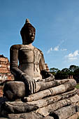 Ayutthaya, Thailand. Wat Mahathat, Buddha statue of the gallery enclosing the collapsed central prang.